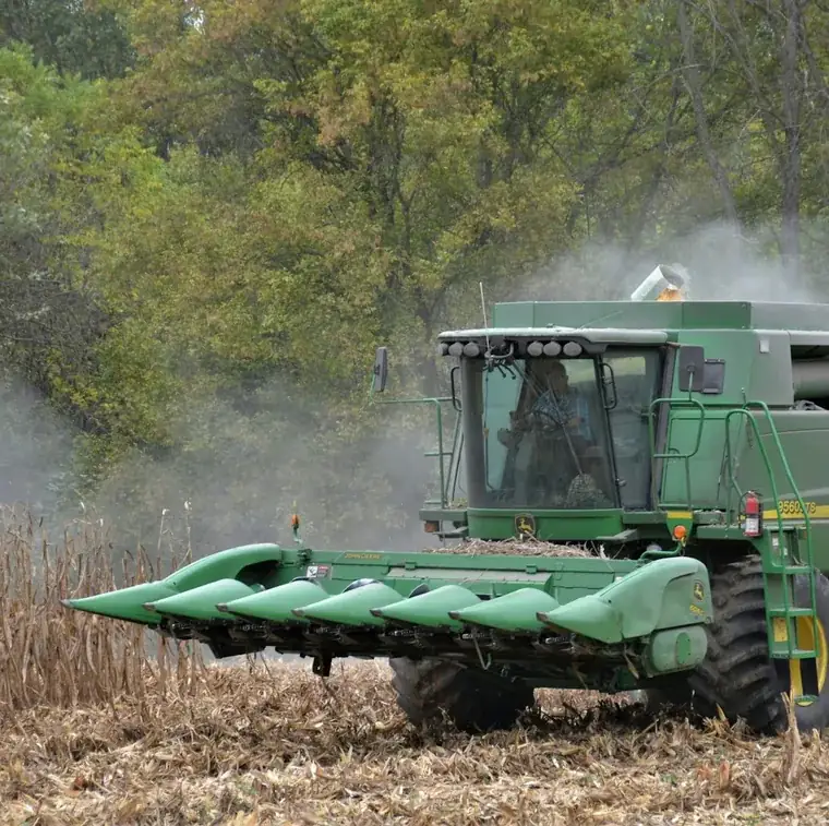 Combine harvesting corn in a Champaign County Ohio field